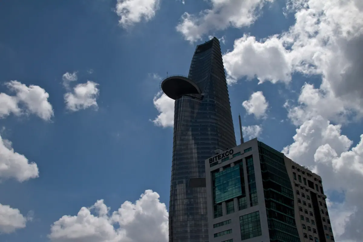 Bitexco Tower with its helipad against deep blue sky and clouds